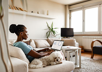 Woman reviewing her HSA account on her laptop